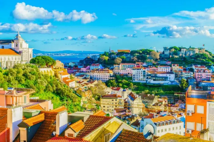 Lisbon European spring city break with colourful tram and sunny streets